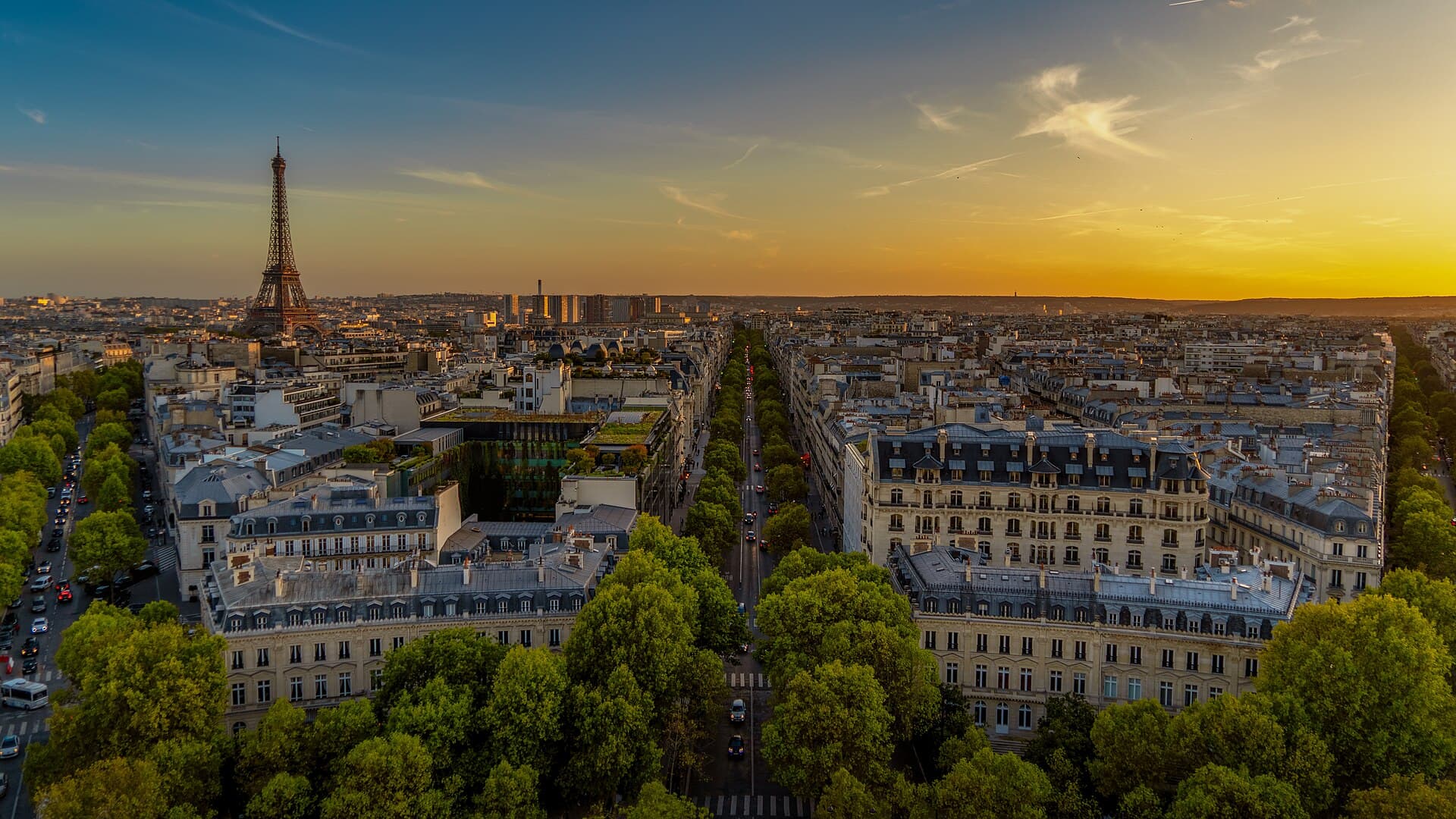 Pierre Blaché, Wikimedia Commons, CC0 Paris at sunset, viewed from the Arc de Triomphe, with the Eiffel Tower in the distance